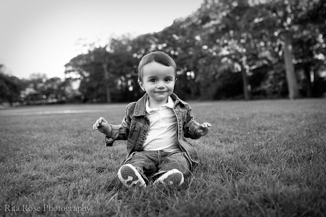 Little boy sitting on a lawn - black and white photography - Boston, New York, Miami